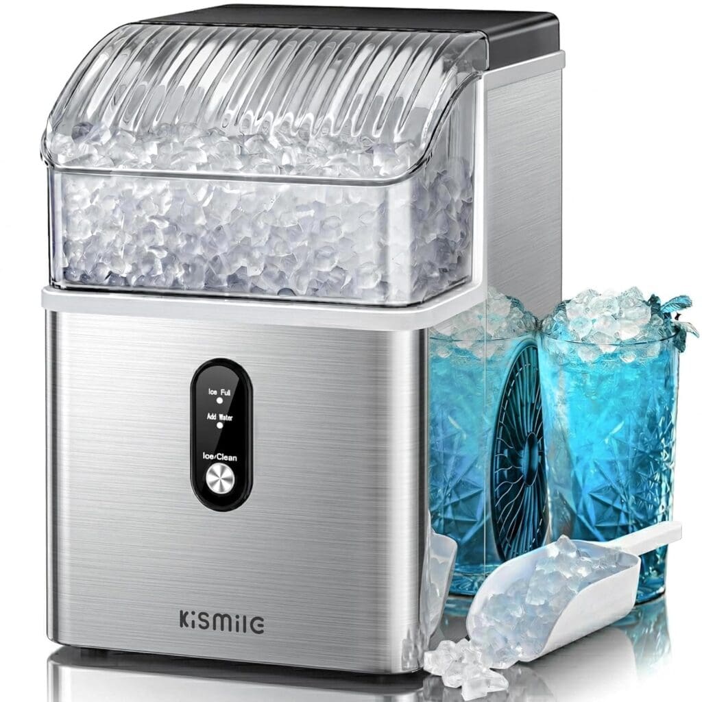 A stainless steel ice maker filled with ice, next to a blue glass filled with ice and a white scoop, on a white background. The ice maker displays labeled buttons on the front—perfect for stocking up during your Monday Deals.
