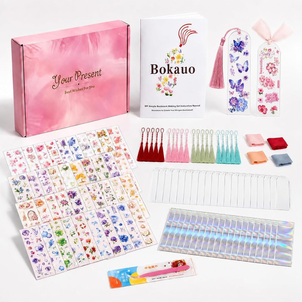 A DIY bookmark kit with a pink gift box, instruction booklet, floral and butterfly bookmarks, tassels, charm chains, decorative stickers, small fabric squares, and a colorful envelope—all neatly arranged on a white surface—makes the perfect pick for Thursday Deals.
