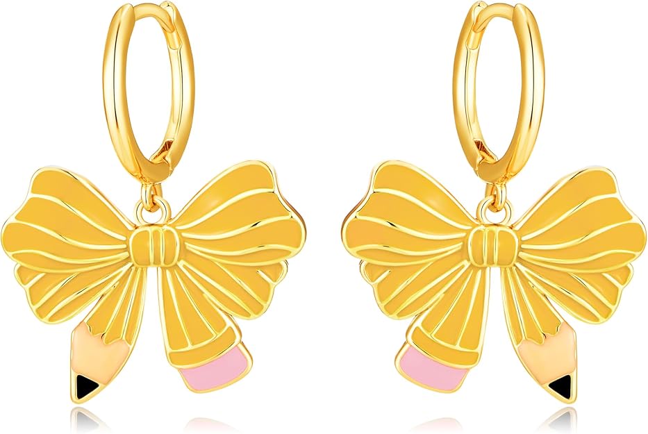 Gold hoop earrings with dangling charms shaped like bows and pencils—perfect for adding playful flair to any look. The pencils feature pink erasers and black tips, hanging from the center of each bow. Don’t miss these unique earrings in our Thursday Deals!.