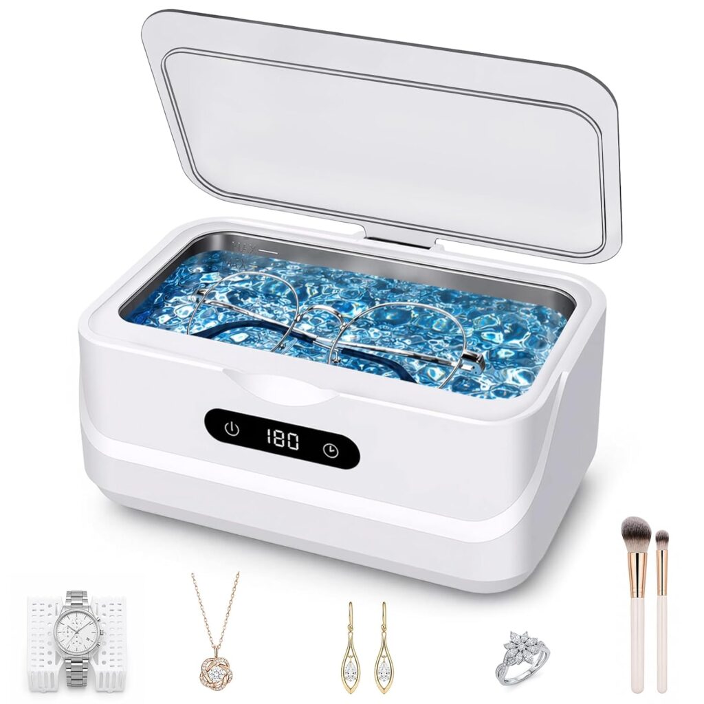 A white ultrasonic cleaner with eyeglasses inside, filled with blue water. Below the cleaner are images of a watch, necklace, earrings, ring, and makeup brushes, showing possible items for cleaning.