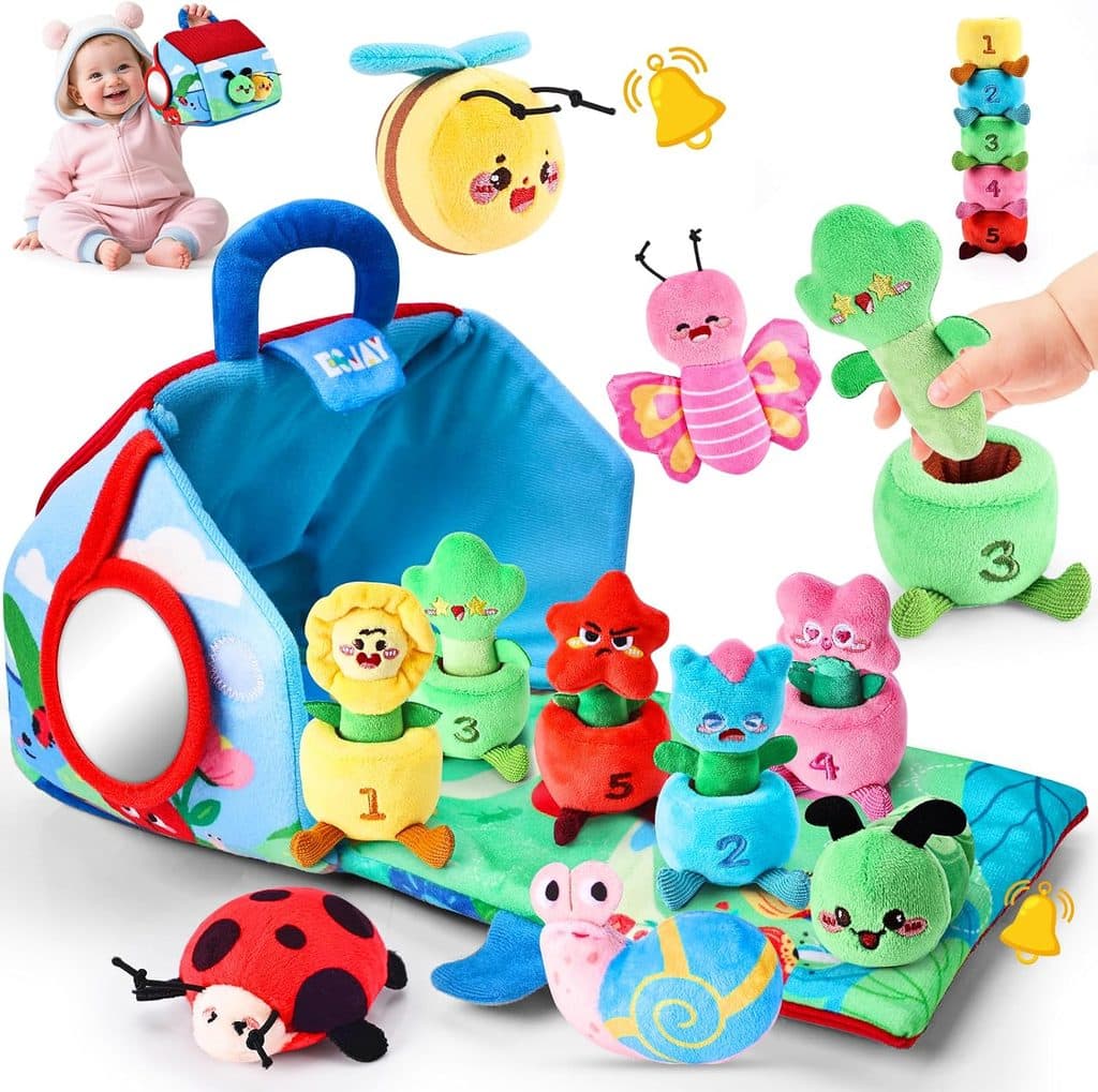A colorful baby toy set with plush flowers and animals, a blue carrying case, stackable pots labeled 1-5, a mirror, and a smiling baby in the background playing with a soft cube—perfect for little learners and now available as part of our Wednesday Deals!.