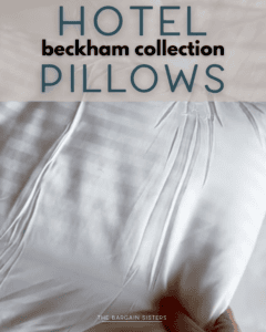 A hand squeezes a white pillow with subtle stripes. Text on the image reads: “HOTEL beckham collection PILLOWS.”.