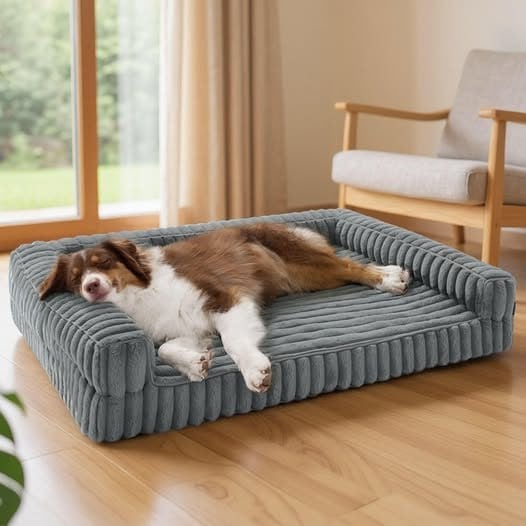 A dog resting on a Bedsure fleece-topped memory foam orthopedic dog bed, featured in our Friday Deals.