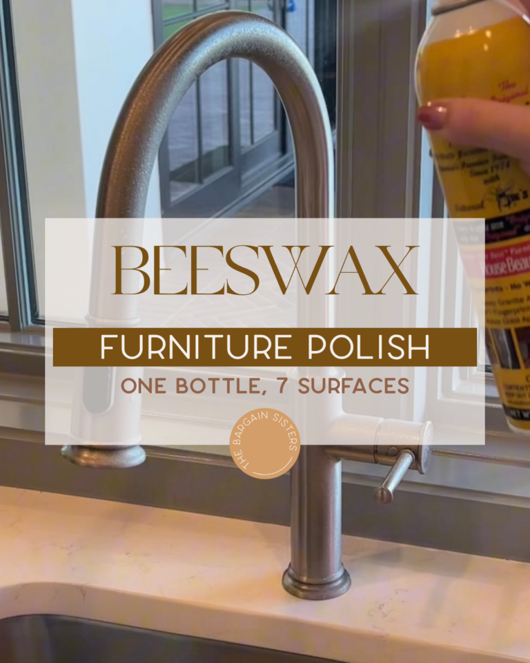 A hand holds a can of beeswax furniture polish near a kitchen sink. Text overlay reads: “Beeswax Furniture Polish. One bottle, 7 surfaces. The Bargain Sisters.”.