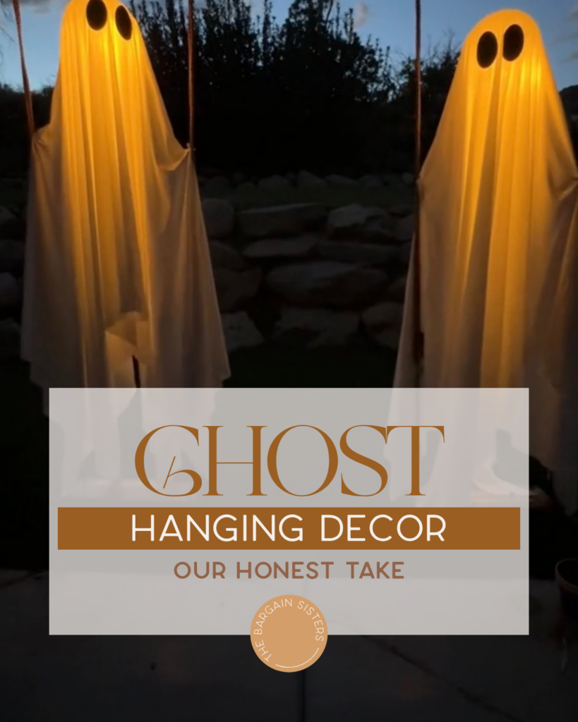 Two glowing ghost decorations hang outdoors at dusk, draped in white sheets with black eyes. Text overlay reads, “Ghost Hanging Decor: Our Honest Take. The Bargain Sisters.”.