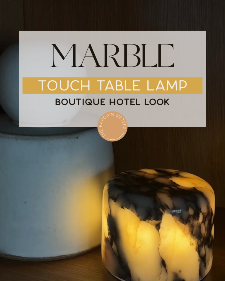 Two marble lamps are displayed on a wooden surface. One lamp is white and cylindrical, while the other is shorter, round, and glows with warm light, showcasing black and gold marble patterns. Text overlay promotes marble touch table lamps.