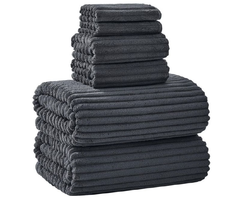 A folded stack of plush oversized bath towels in a neutral color, featured in our Friday Deals.