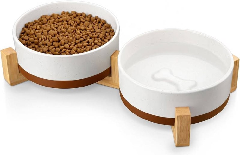 A set of ceramic dog food and water bowls on a stand, featured in our Thursday Deals.