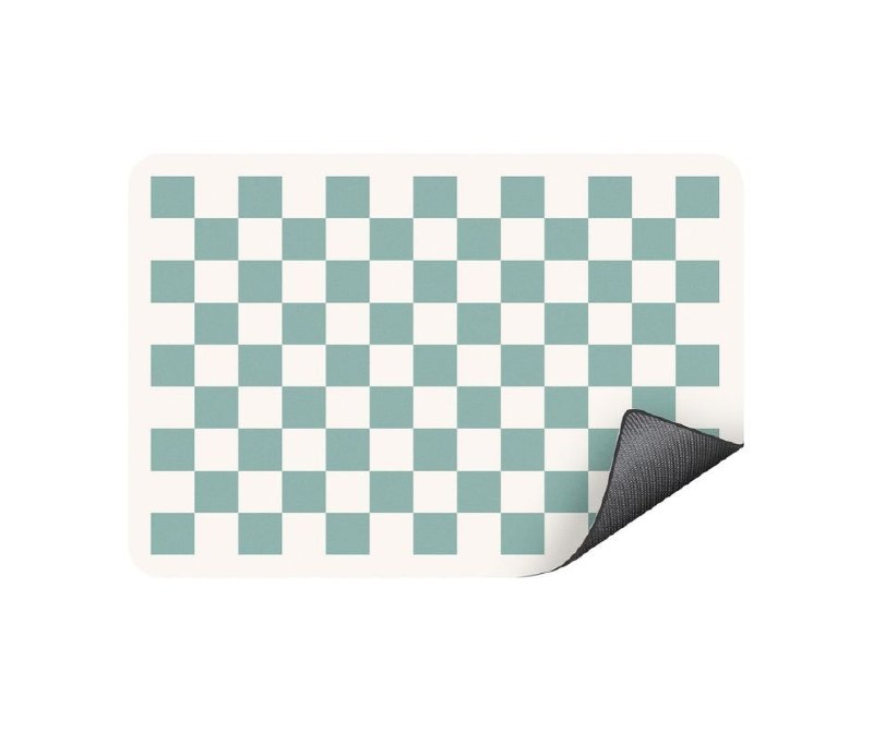 An absorbent checkered dish drying mat laid out on a kitchen counter featured in our Monday Deals.