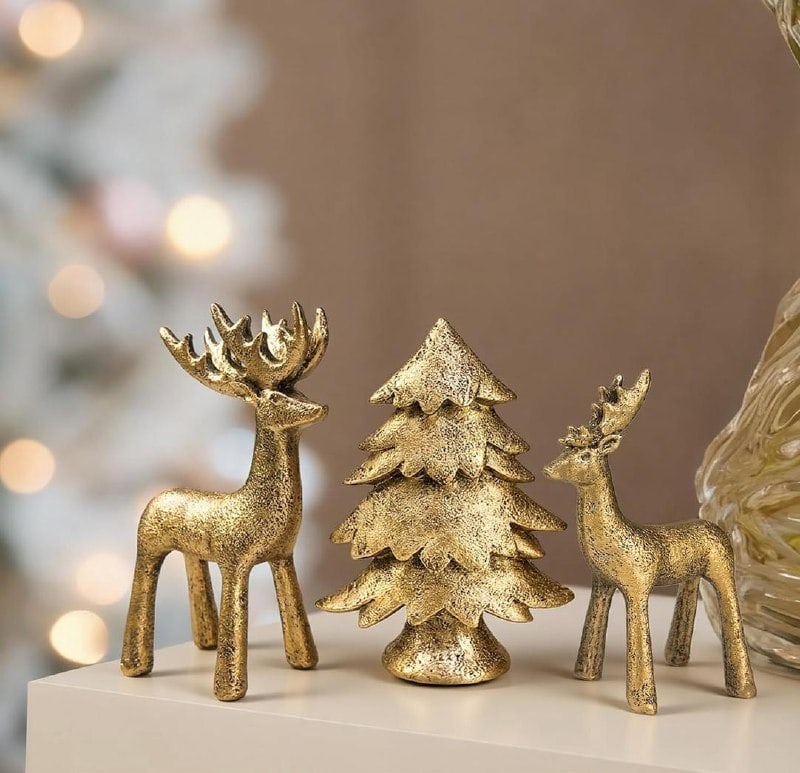 A set of three Christmas reindeer and tree figurines for holiday decor, featured in our Thursday Deals.