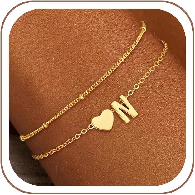 A dainty gold-tone personalized initial bracelet with a small letter charm on a slim chain, featured in our Wednesday Deals.