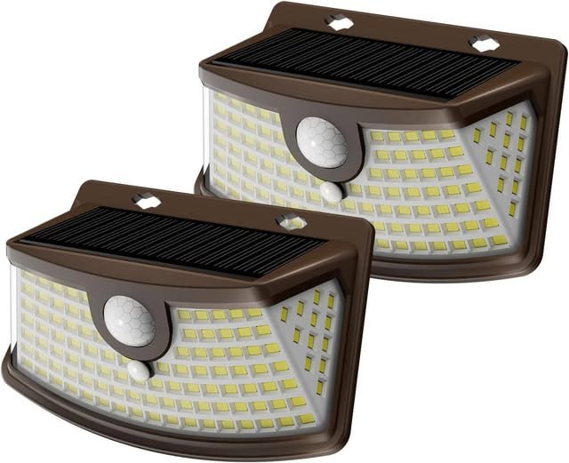 Outdoor solar powered motion sensor lights mounted on a wall to light up a walkway at night, featured in our Tuesday Deals.